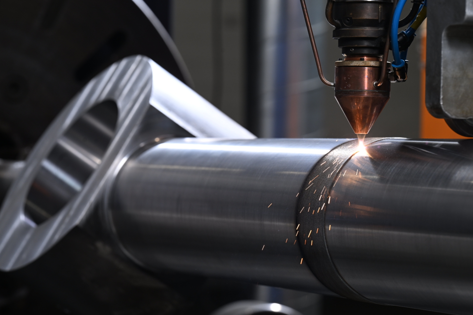 Metal powder is precisely fused onto a component using a high-powered laser to demonstrate Laser Cladding